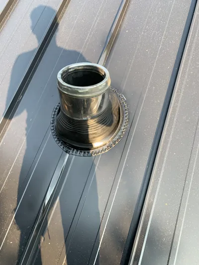 Low-profile vent stack flashing on metal roof, Okanagan