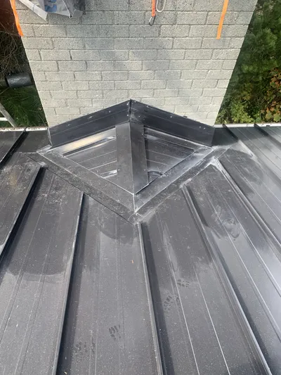 Custom chimney flashing on metal roof, Okanagan BC