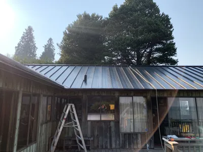 Angle view of finished metal roof on waterfront cabin, Okanagan BC