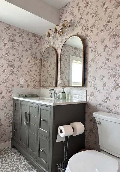 Finished bathroom renovation with large-format tile and glass shower enclosure, Kelowna BC