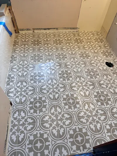 Large-format tile dry-layout in Kelowna bathroom renovation