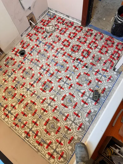 Floor tile installation during Kelowna bathroom renovation