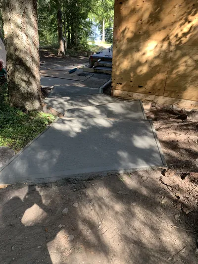 Poured concrete stairs connecting lakeside deck levels, Kelowna