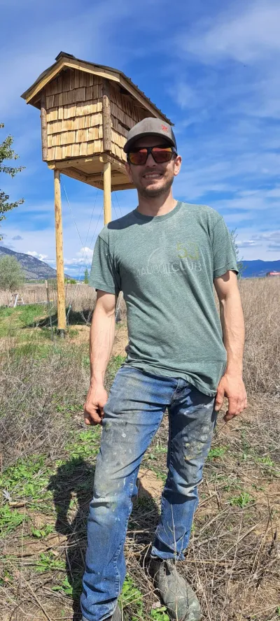 Liam Kinders in front of the Okanagan Bat Condo at Penticton Channel Parkway
