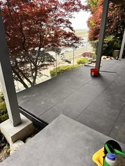 Two-level lakeside deck with infinity glass railing overlooking Okanagan Lake, Kelowna BC